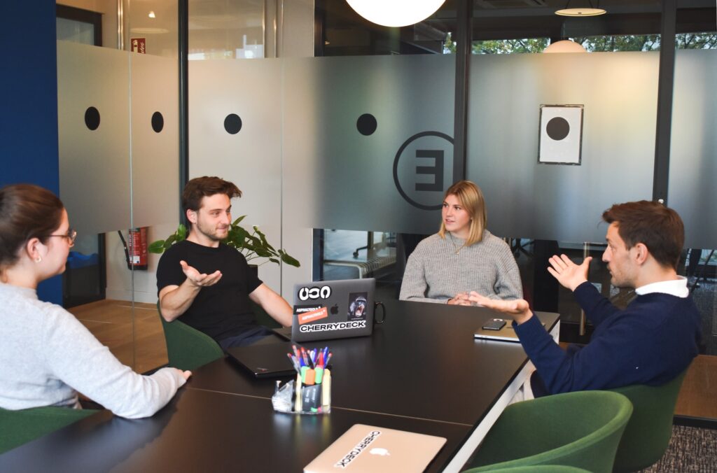 two men two women in a meeting
Photo by Cherrydeck on Unsplash