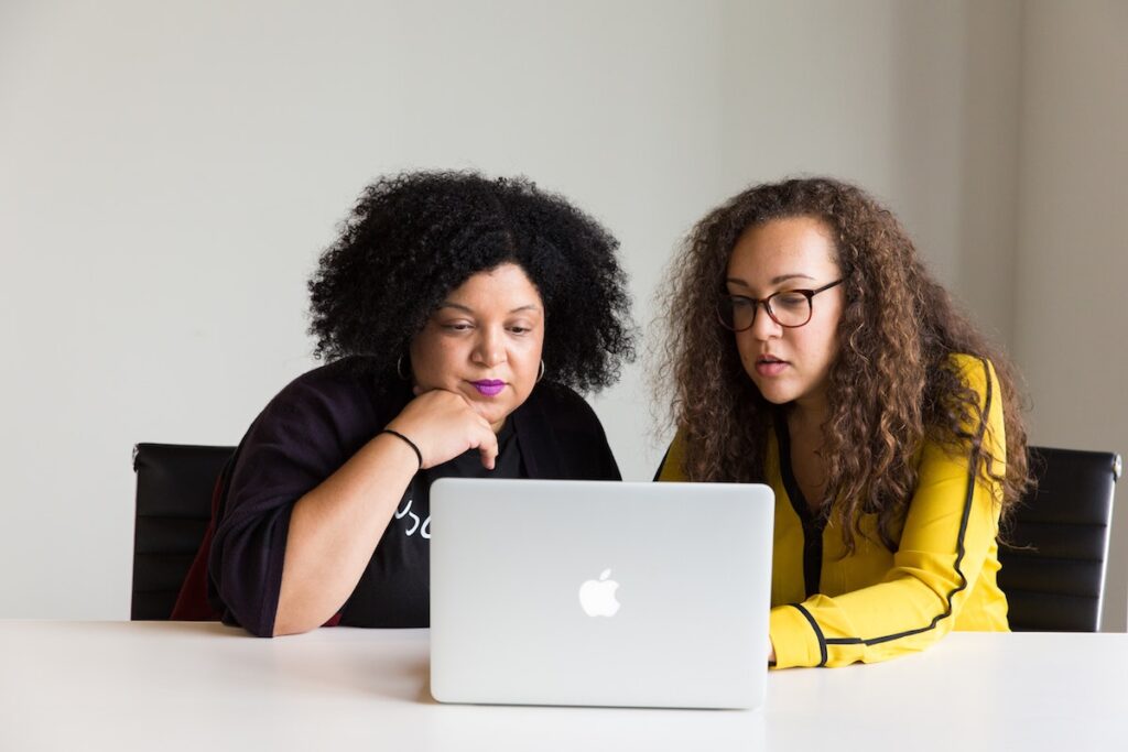 Photo of two women at a laptop - Photo by Christina @ wocintechchat.com on Unsplash