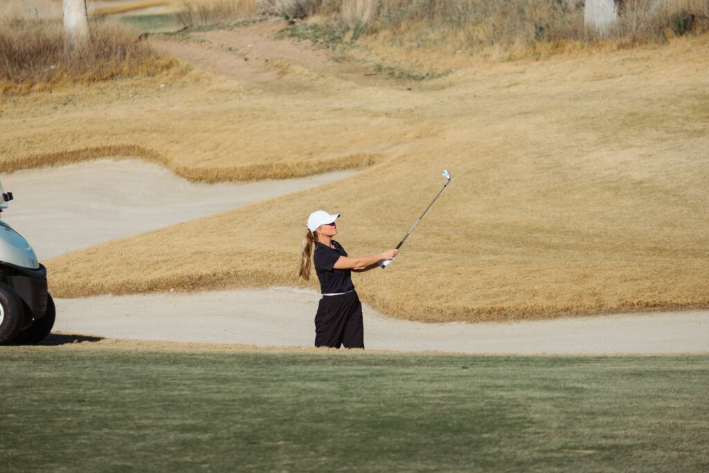 Image of a woman playing golf